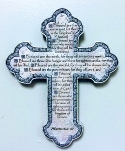 a ceramic cross with the Beatitudes Matthew 5:3-10