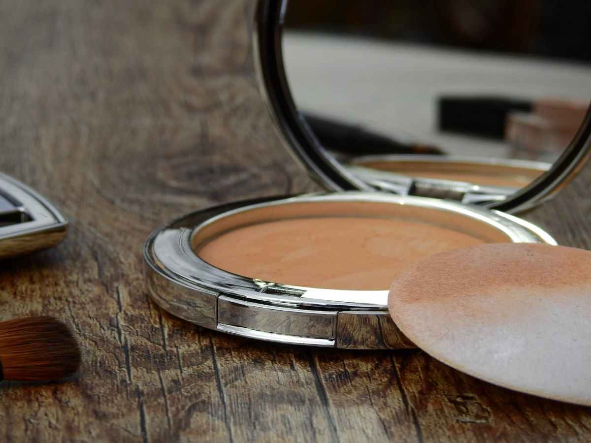 compact makeup with a mirror and sponge