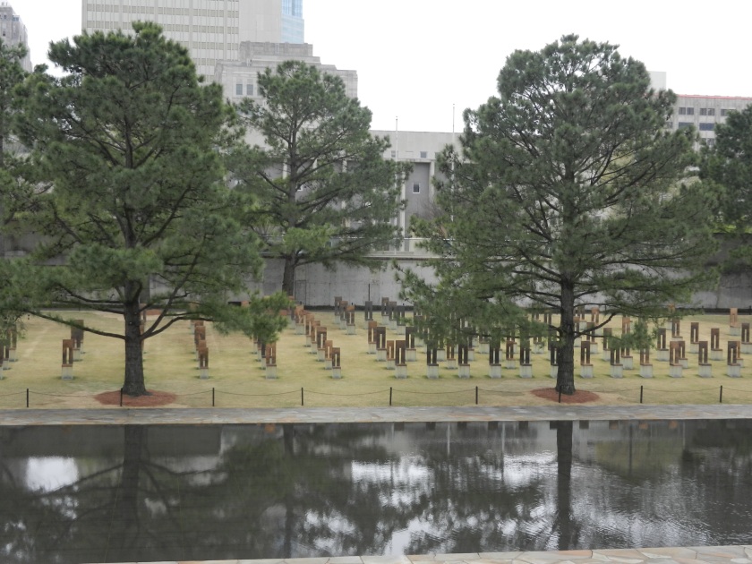 gold memorial chairs by reflecting pool