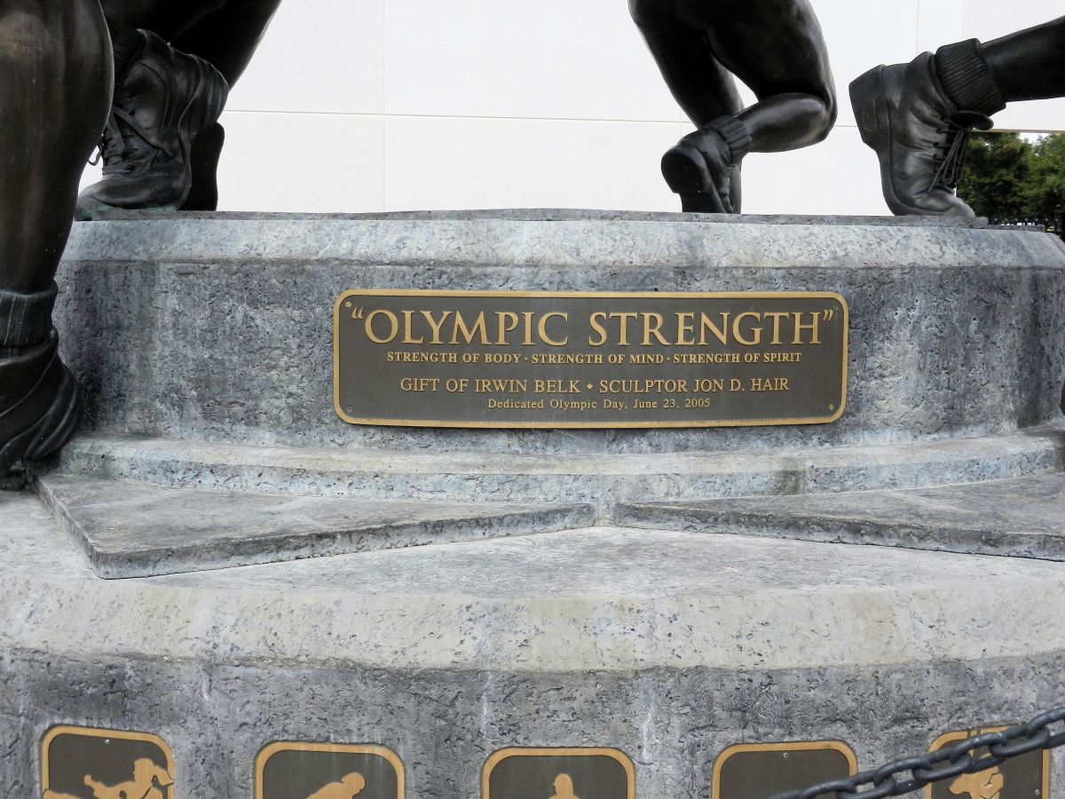 OLYMPIC STRENGTH-plaque on a statue