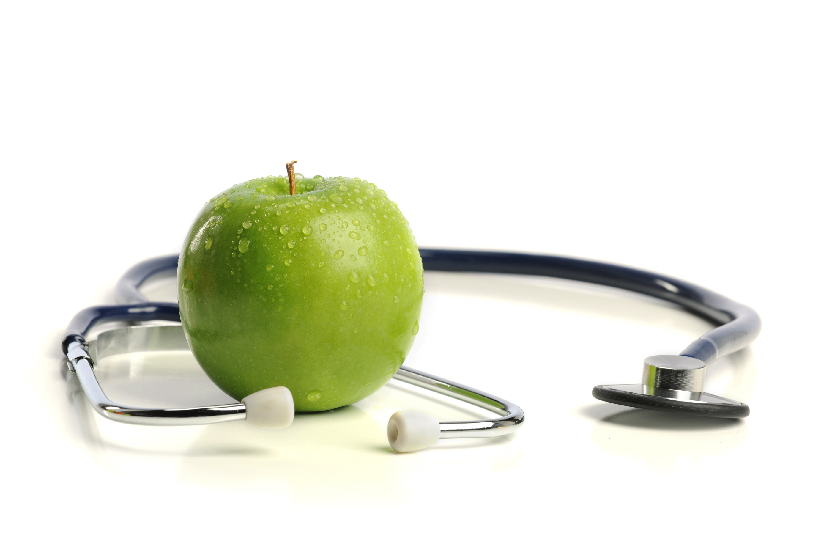 a Stethoscope and a green Apple